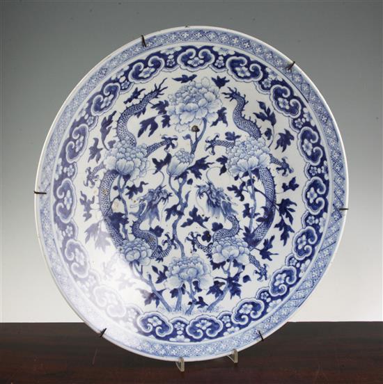 A Chinese blue and white dragon charger, 19th century, diam. 47cm